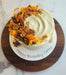 Gorgeous cake displayed on Virginia Boys Kitchens 13.5 Inch Round Walnut Cutting Board